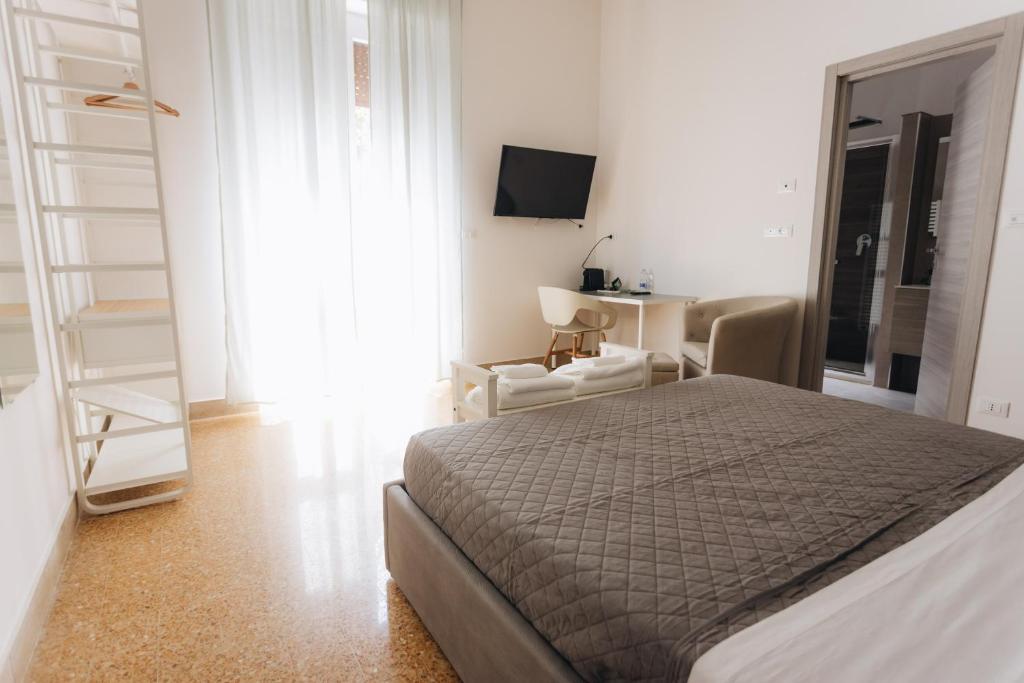Posteľ alebo postele v izbe v ubytovaní THE NEST - B&B - Suites