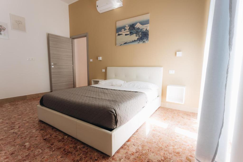 Posteľ alebo postele v izbe v ubytovaní THE NEST - B&B - Suites