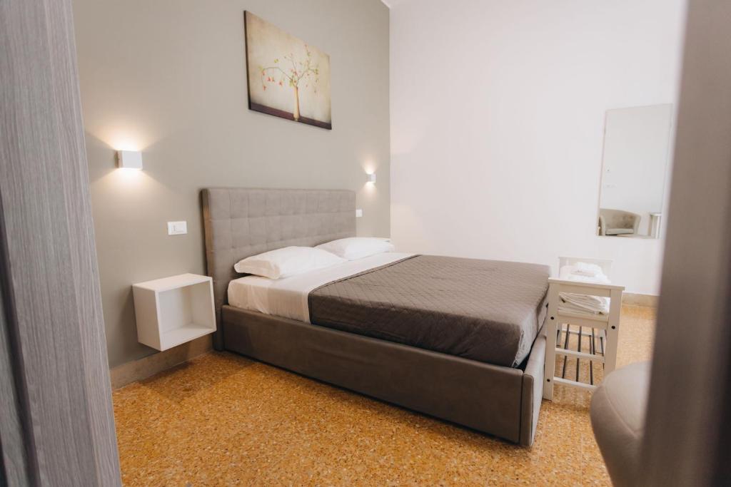Posteľ alebo postele v izbe v ubytovaní THE NEST - B&B - Suites