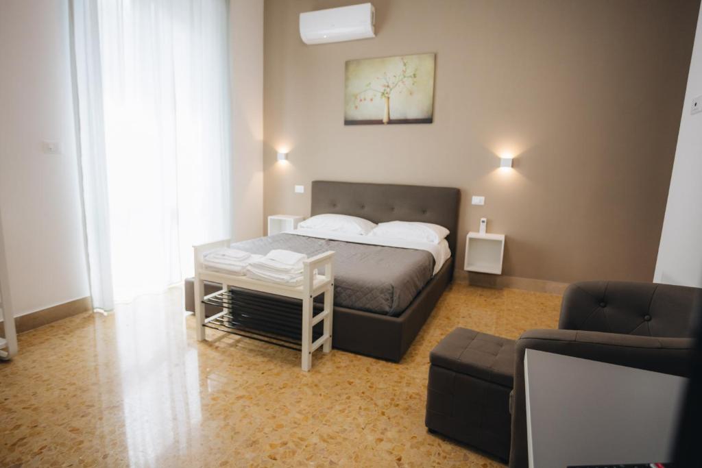 Posteľ alebo postele v izbe v ubytovaní THE NEST - B&B - Suites