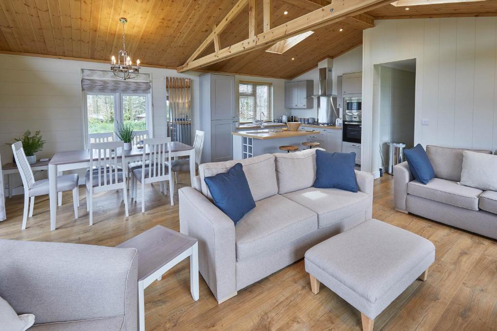 a living room with a couch and a dining room at Host & Stay - Salt & Seaweed in Runswick