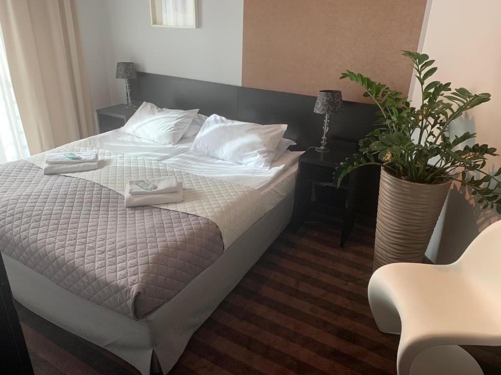 Postel nebo postele na pokoji v ubytování Hotel Blick