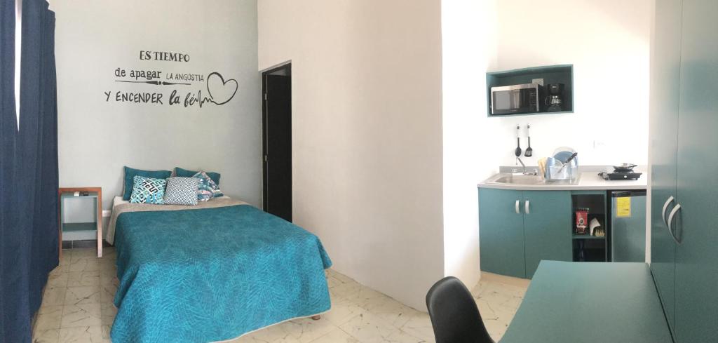 Llit o llits en una habitació de Suites del Sureste - Mérida