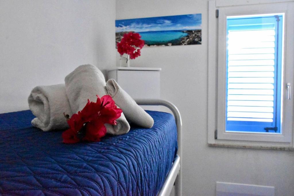 Postel nebo postele na pokoji v ubytování Casa Nettuno Favignana