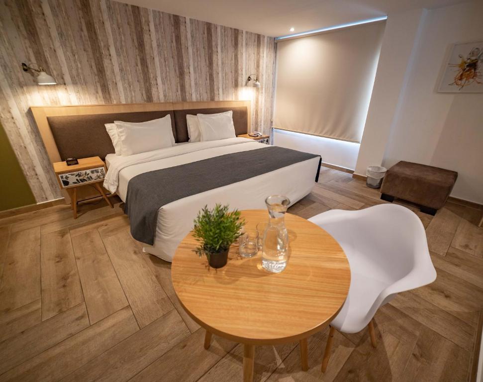 Postel nebo postele na pokoji v ubytování 1460 Luxury Room KAIA - Best Place in Quito