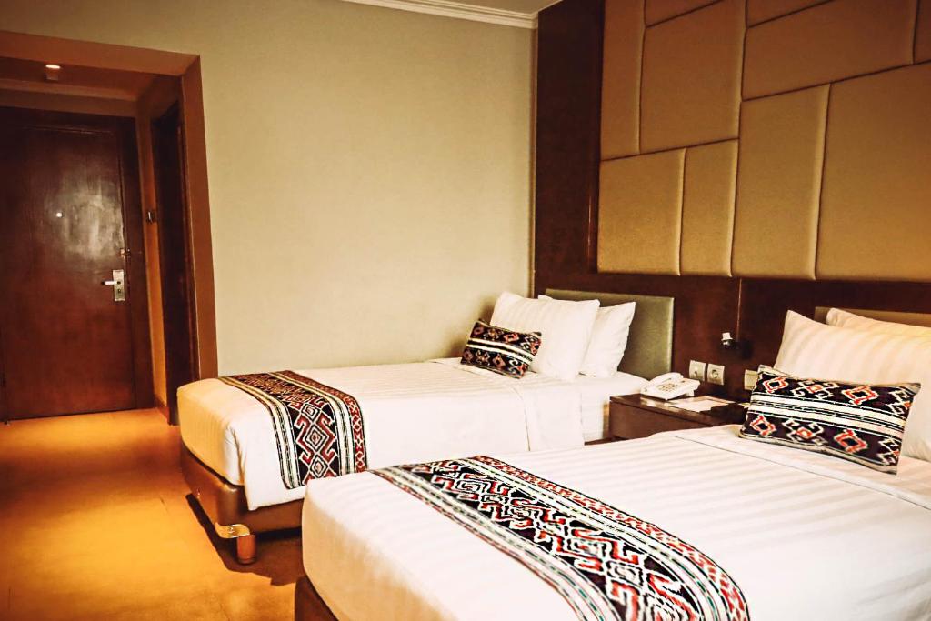 Tempat tidur dalam kamar di SOTIS Hotel Kemang, Jakarta
