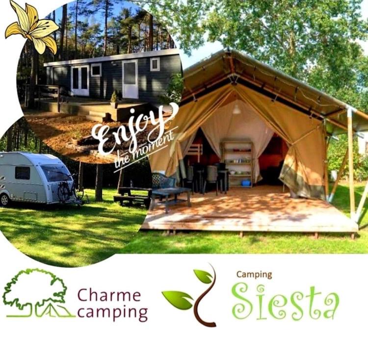 una tienda de campaña con un remolque y un camping camping camping camping camping camping camping resort en Camping Siesta, en Lille