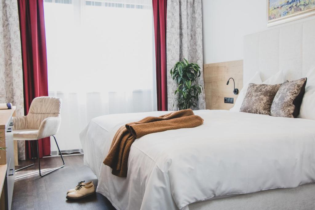 Postel nebo postele na pokoji v ubytování Boutique Hotel Edelmanns