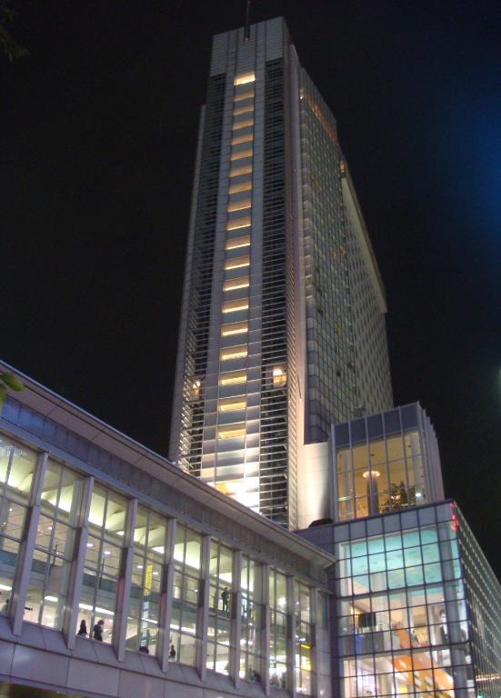 a tall building with many windows at night at Shibuya Excel Hotel Tokyu in Tokyo
