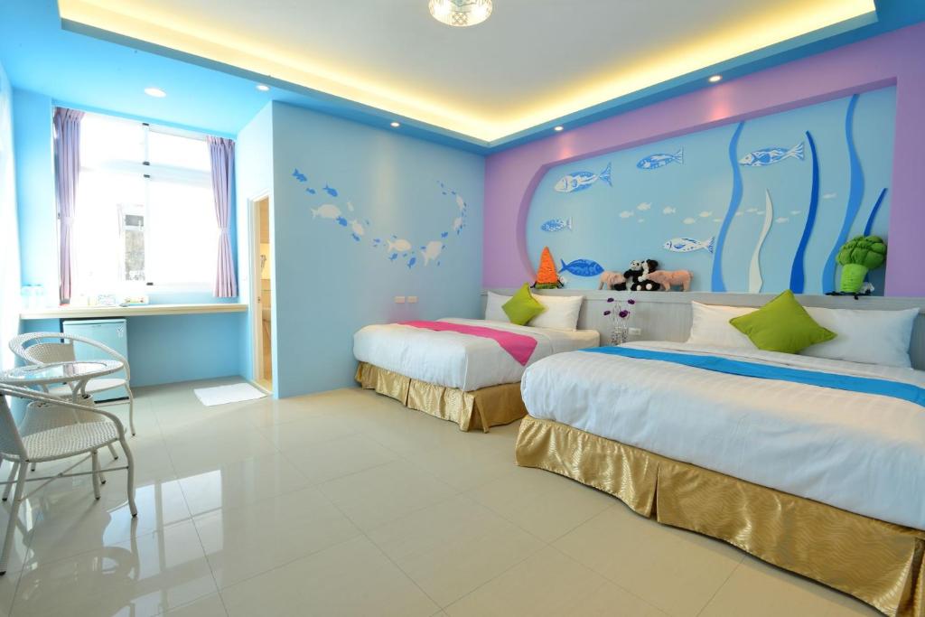 Postel nebo postele na pokoji v ubytování Mu Yu B&B