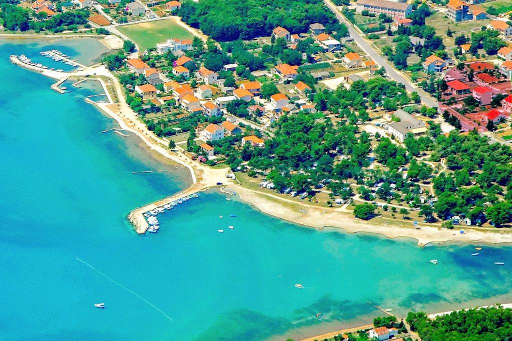 an aerial view of a beach with boats in the water at Apartments Valentin in Privlaka