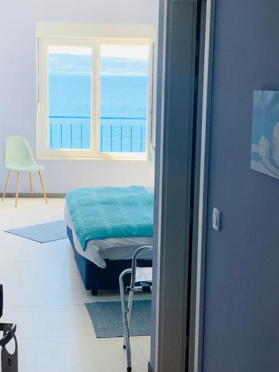 Posteľ alebo postele v izbe v ubytovaní Hotel Elu Iris