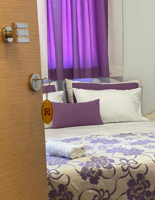 Postel nebo postele na pokoji v ubytování Maria Hotel Sisi