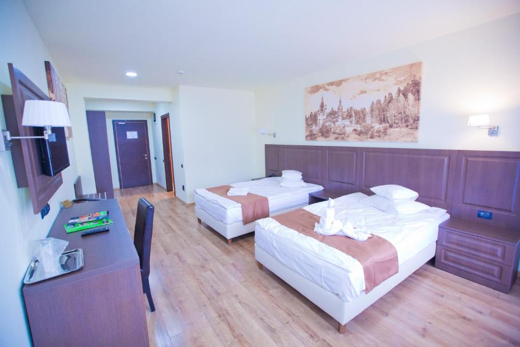 Postel nebo postele na pokoji v ubytování Hotel Piemonte