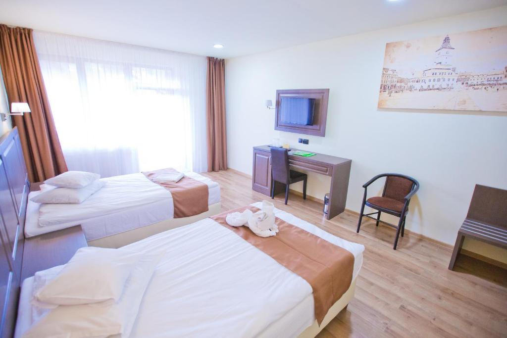 Postel nebo postele na pokoji v ubytování Hotel Piemonte