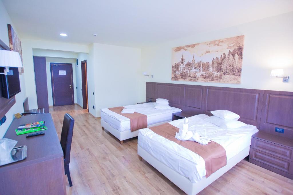 Postel nebo postele na pokoji v ubytování Hotel Piemonte