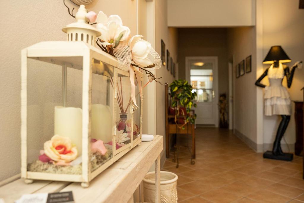 a shelf with vases and other items on it at Vecchio Granaio in Pisa