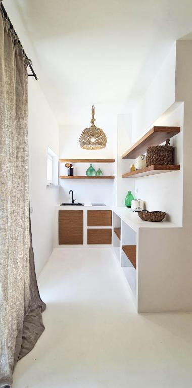 Kuchyň nebo kuchyňský kout v ubytování Sole Suites