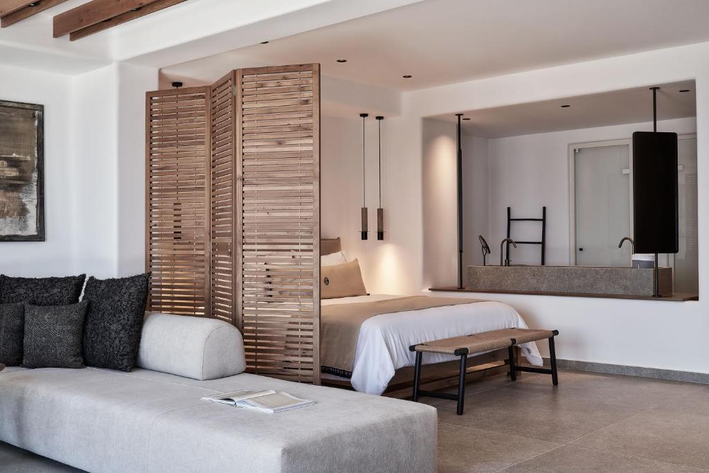 A bed or beds in a room at SantAnna Luxury Suites