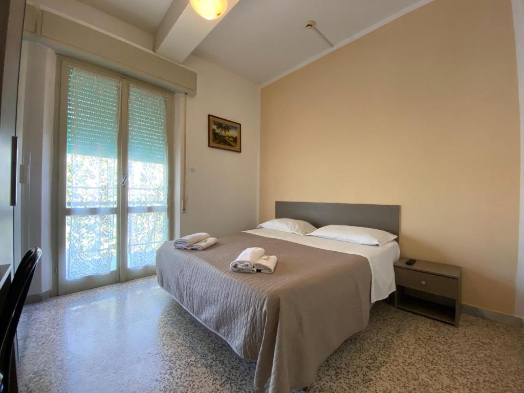 Postel nebo postele na pokoji v ubytování Hotel Britta