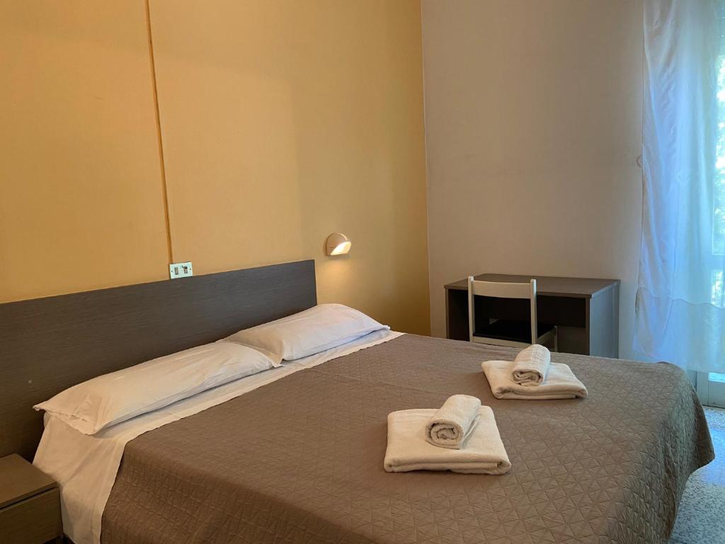 Postel nebo postele na pokoji v ubytování Hotel Britta