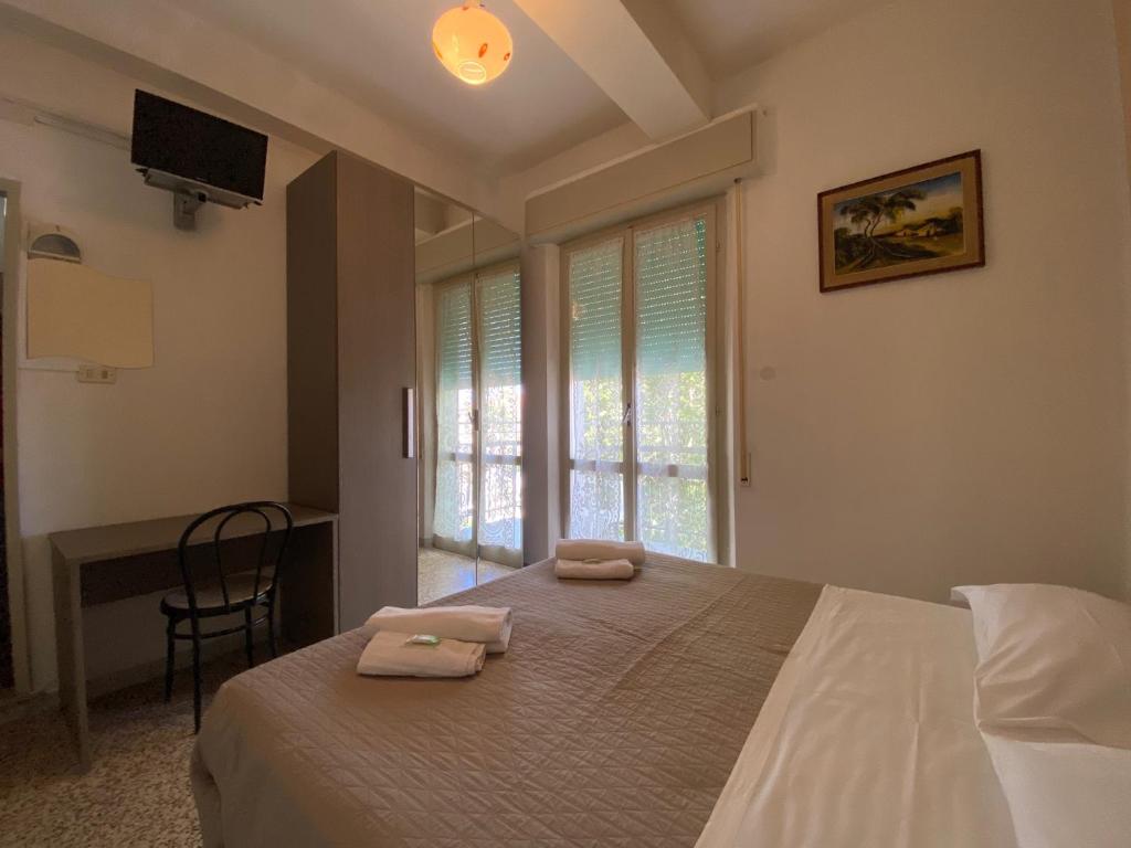 Postel nebo postele na pokoji v ubytování Hotel Britta