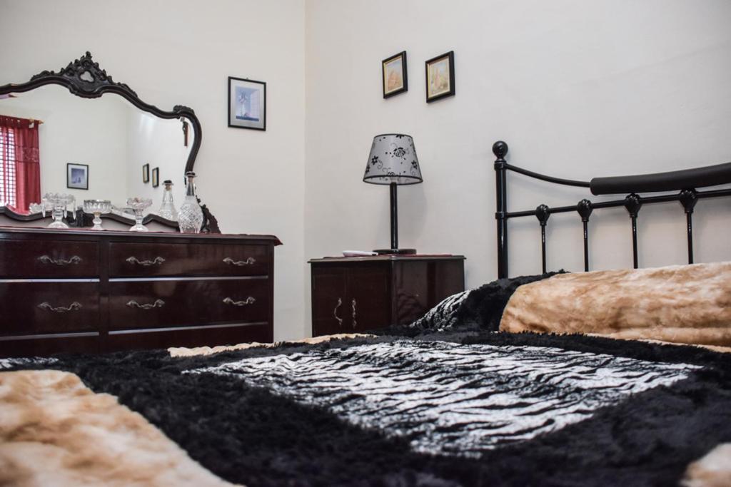 Postel nebo postele na pokoji v ubytování Mangion House