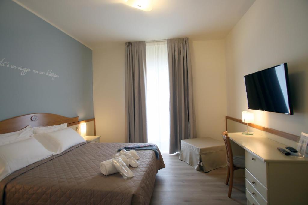 Posteľ alebo postele v izbe v ubytovaní Hotel Le Ginestre Family & Wellness