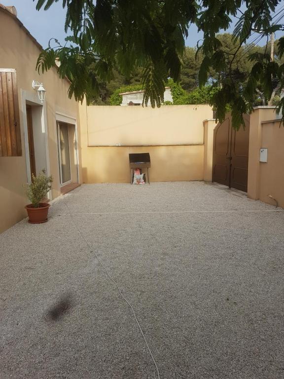 a parking lot with a fireplace in a building at Maison à la semaine in Vitrolles