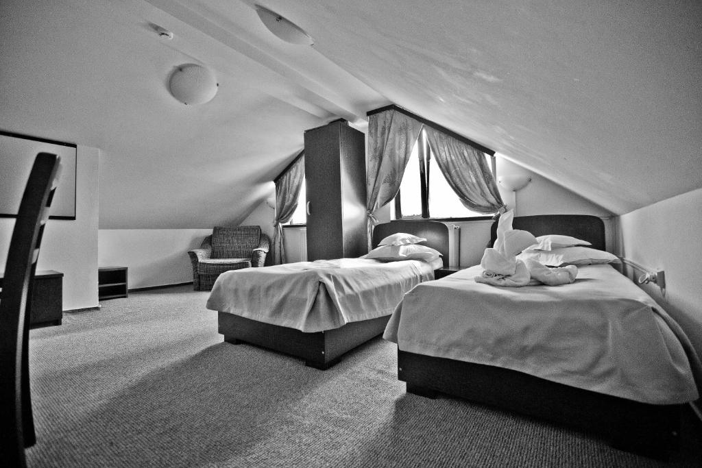Postel nebo postele na pokoji v ubytování Hotel Piemonte