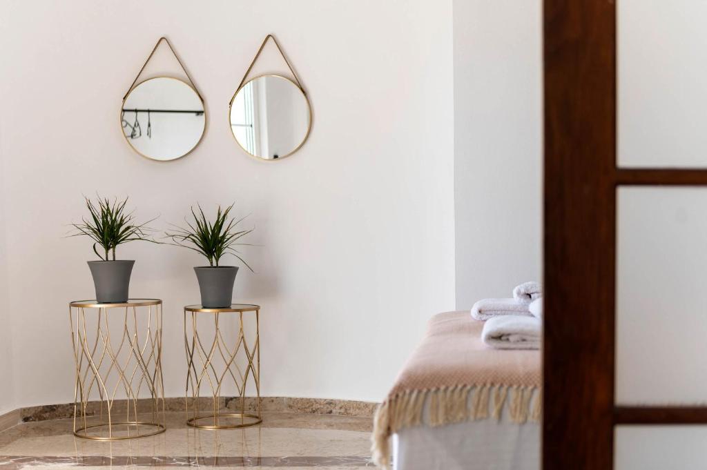 Łóżko lub łóżka w pokoju w obiekcie Alia Apartments