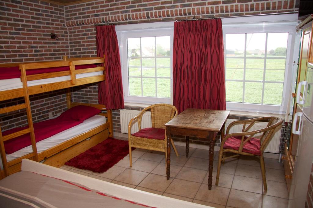 Postel nebo postele na pokoji v ubytování Breeden Steeger Hoeve