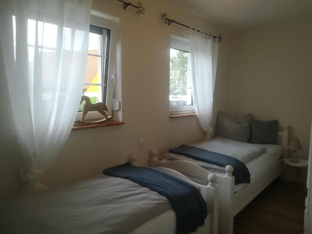 Postel nebo postele na pokoji v ubytování Landhaus Huchatz