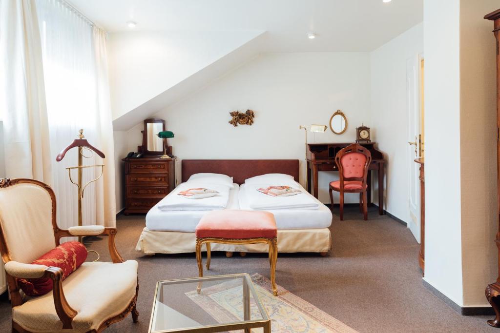 Postel nebo postele na pokoji v ubytování Das Kleine Hotel in ruhiger Stadtlage