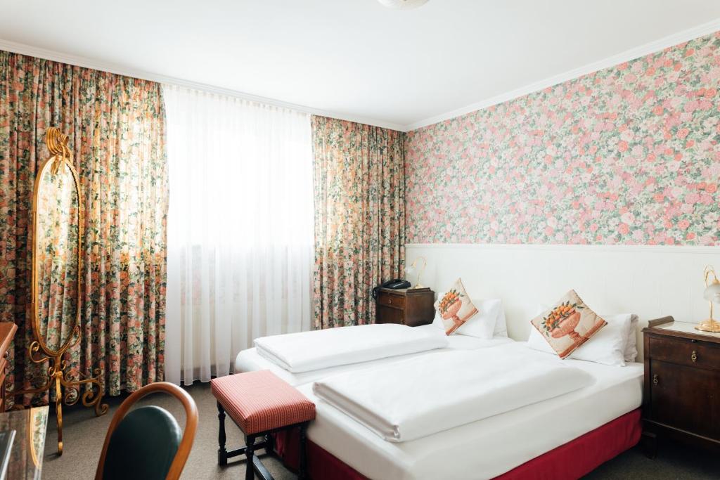 Postel nebo postele na pokoji v ubytování Das Kleine Hotel in ruhiger Stadtlage