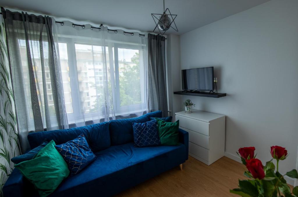 Televízia a/alebo spoločenská miestnosť v ubytovaní Apartament Iga