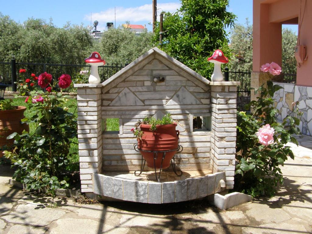 a bird house with two lights on top of it at AGERI STUDIOS in Skala Kallirakhis