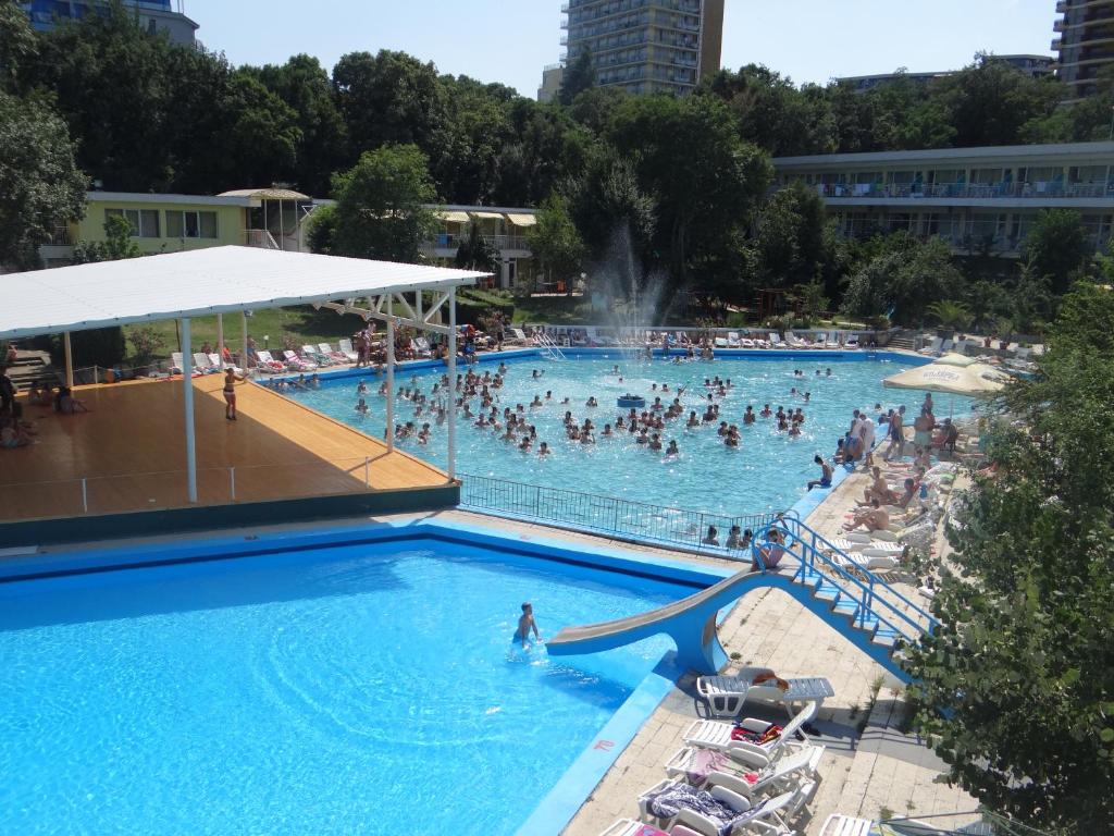 a group of people in a swimming pool at Парк-хотел РИВА in Golden Sands