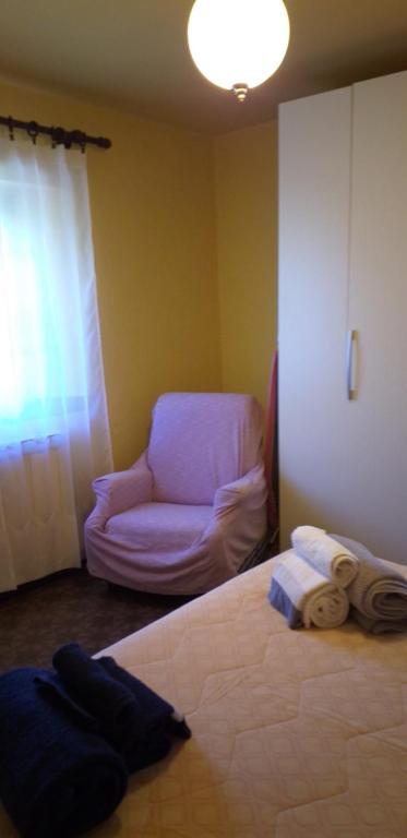 Łóżko lub łóżka w pokoju w obiekcie LA CASETTA DELLA NONNA