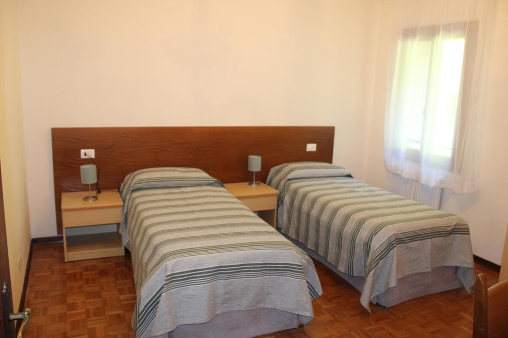 Postel nebo postele na pokoji v ubytování Villa Flangini