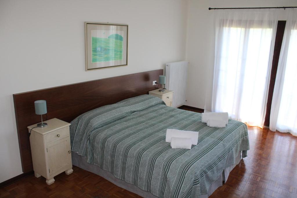 Postel nebo postele na pokoji v ubytování Villa Flangini