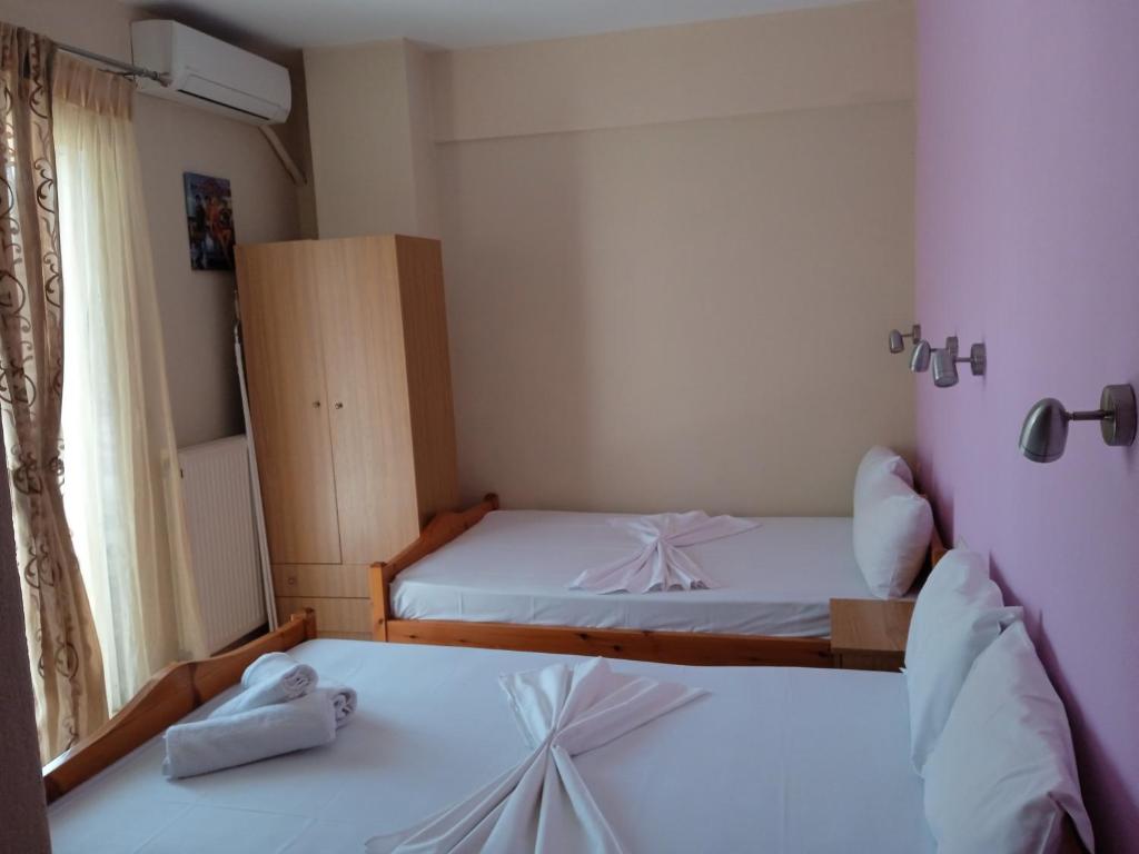 Postel nebo postele na pokoji v ubytování Poseidon rooms