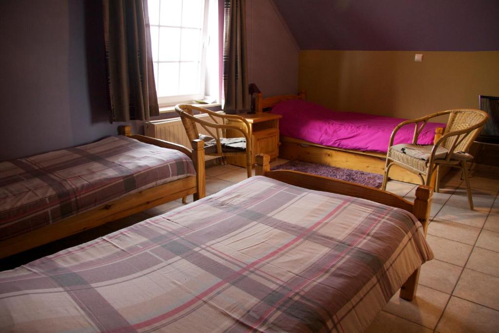 Postel nebo postele na pokoji v ubytování Breeden Steeger Hoeve