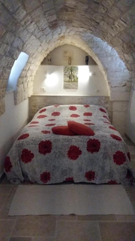A bed or beds in a room at Ostuni Guest House