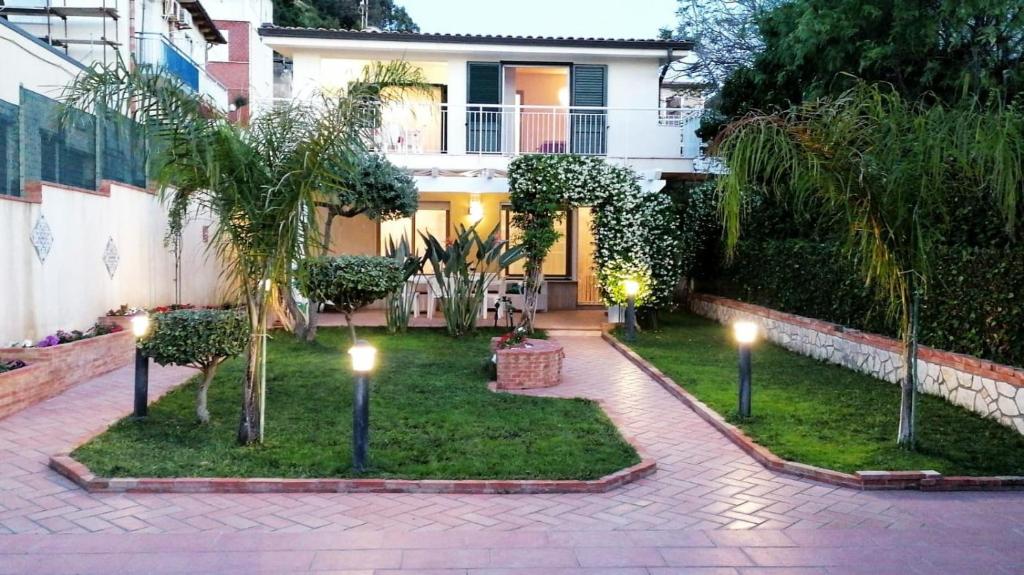 a garden with lights in front of a house at Villa Sole di Sicilia in Alcamo Marina