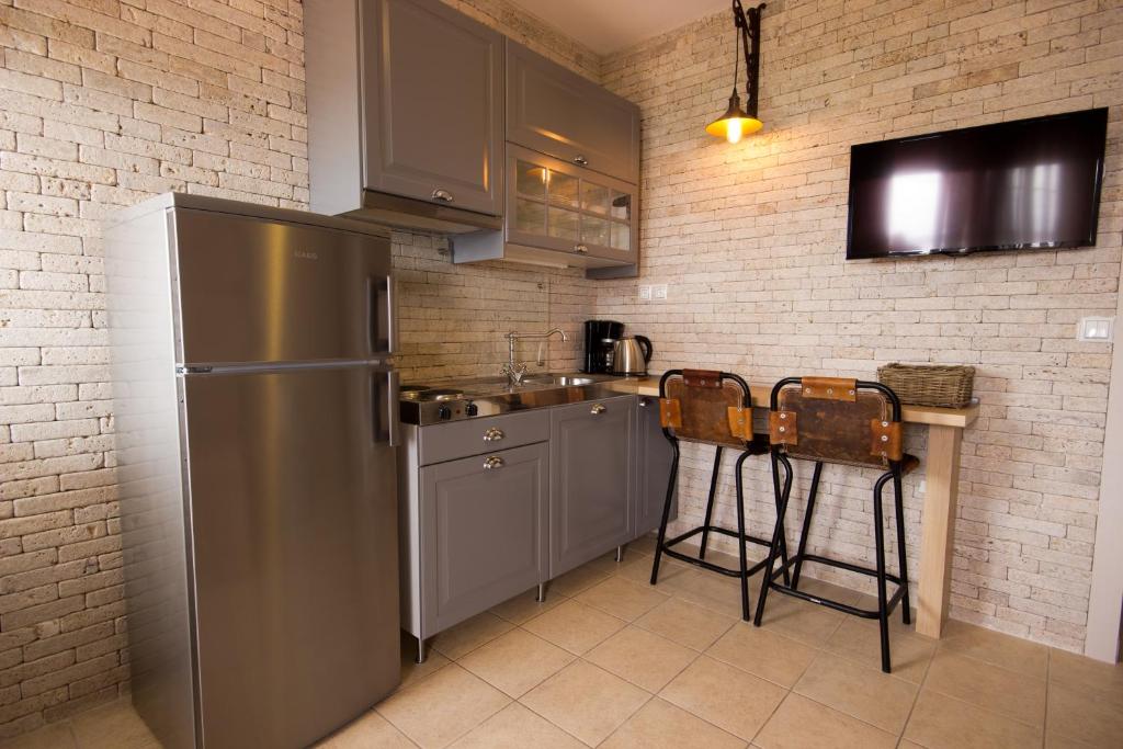 Kuchyň nebo kuchyňský kout v ubytování Villa Teresa Luxury Suites