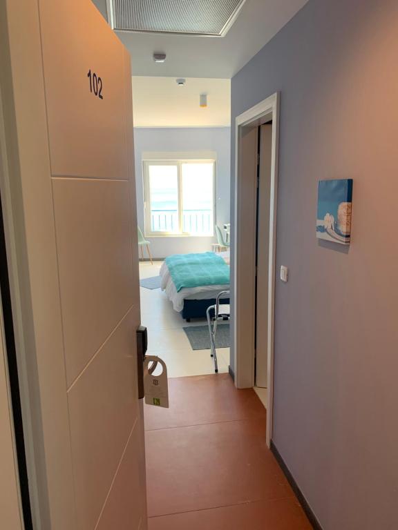 Posteľ alebo postele v izbe v ubytovaní Hotel Elu Iris