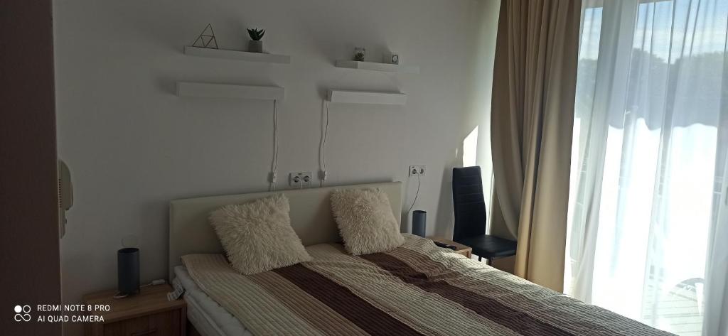 Posteľ alebo postele v izbe v ubytovaní Sunshine 208 apartman
