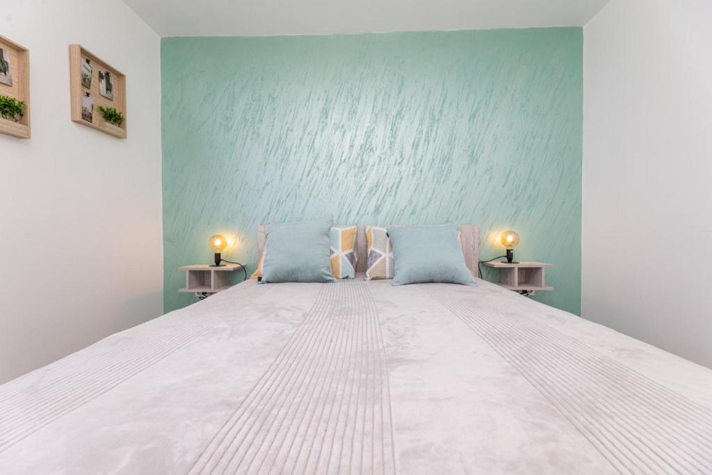 Postel nebo postele na pokoji v ubytování Apartman Gržetić