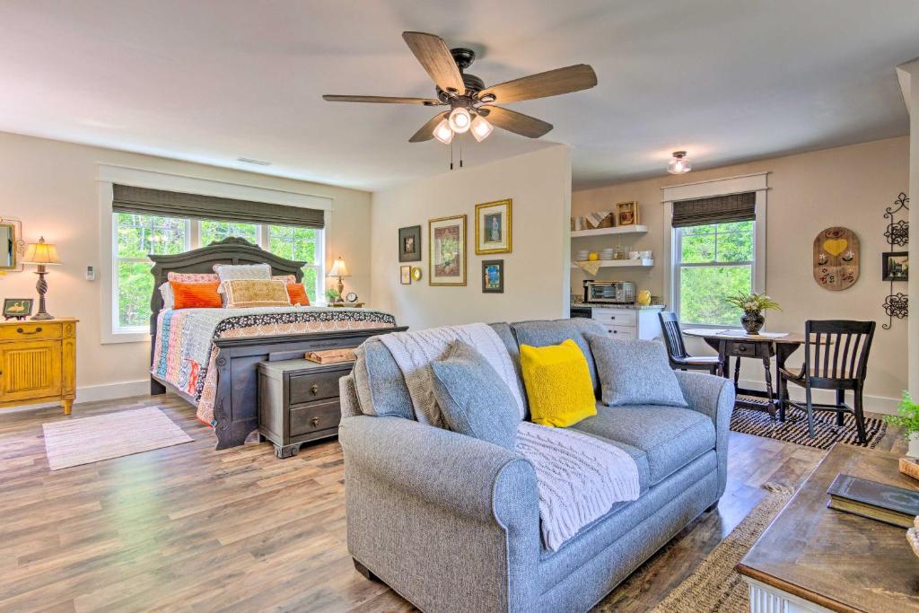 a living room with a couch and a bed at Cozy Landrum Escape by Parks, Trails and Lakes! in Landrum